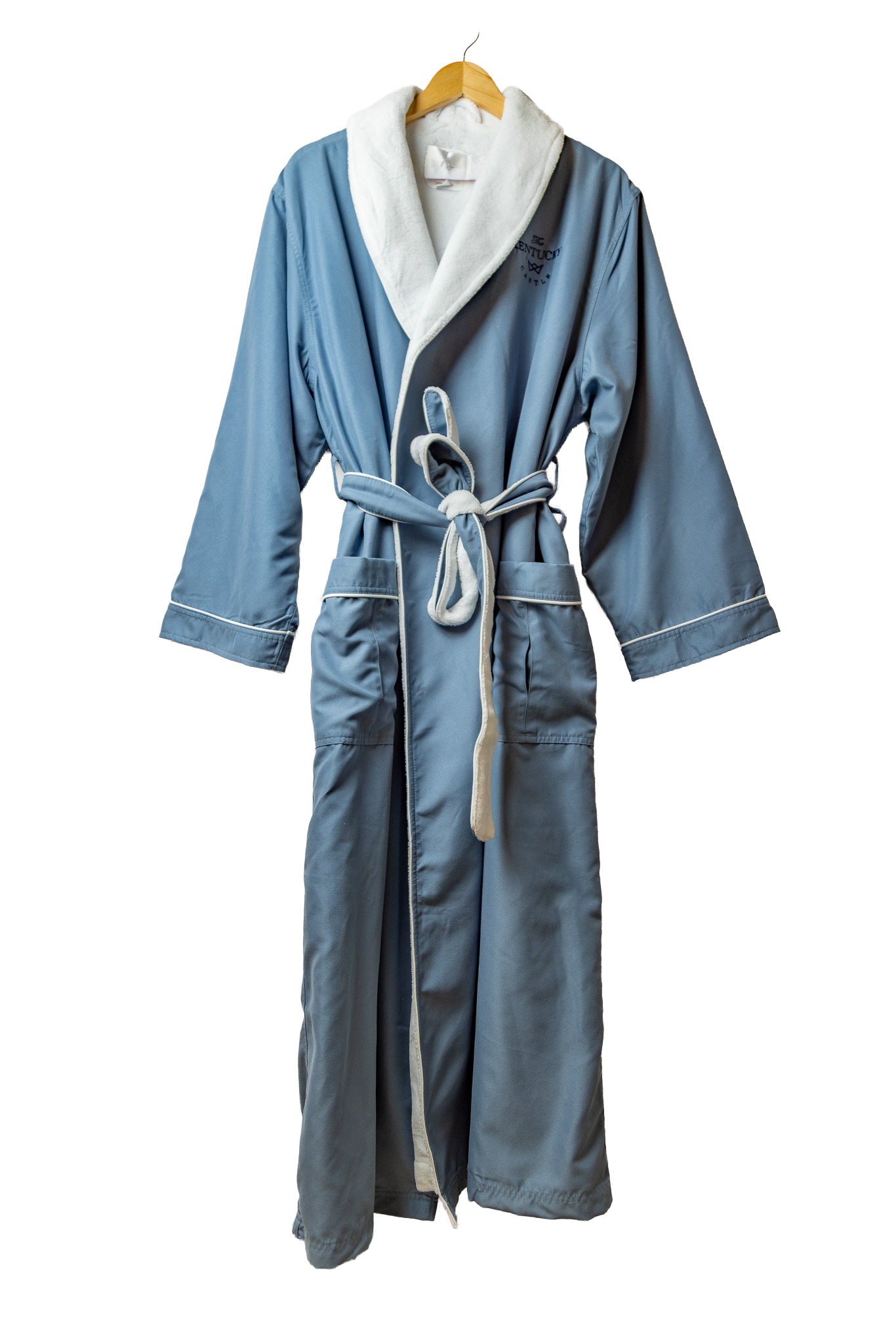 a blue bathrobe laid flat with The Kentucky Castle embroidered on it