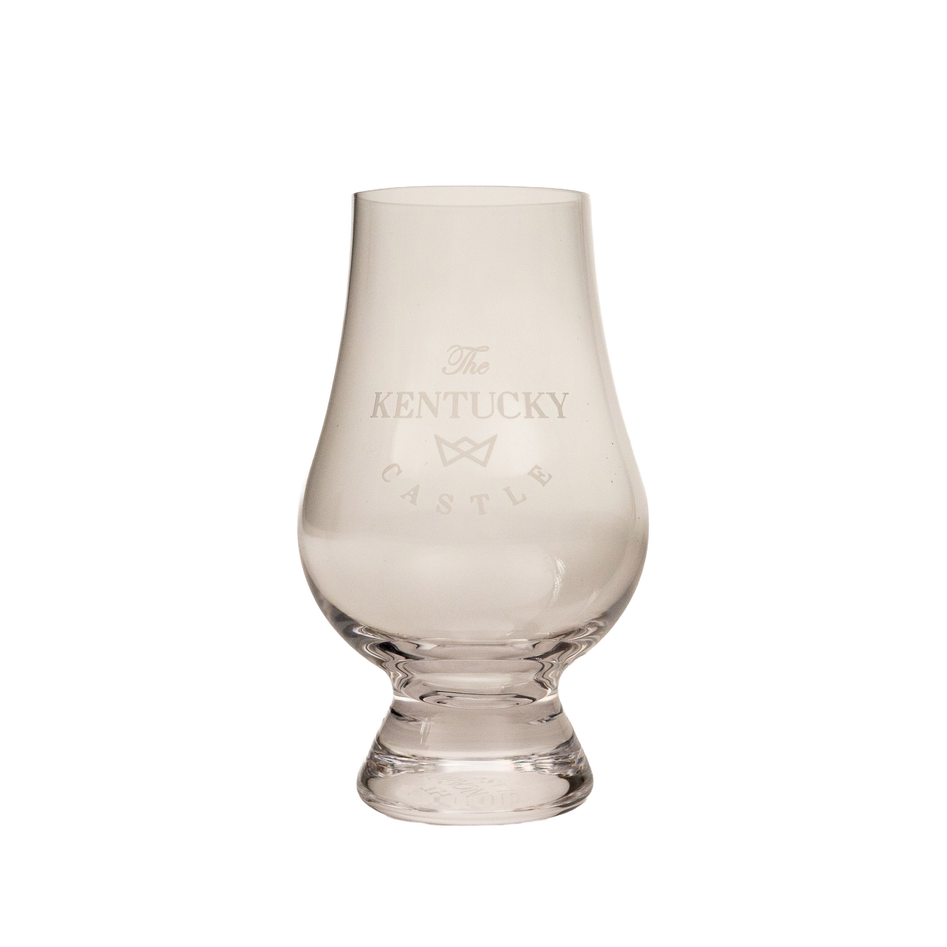 A clear glass tulip-shaped whiskey tasting glass with