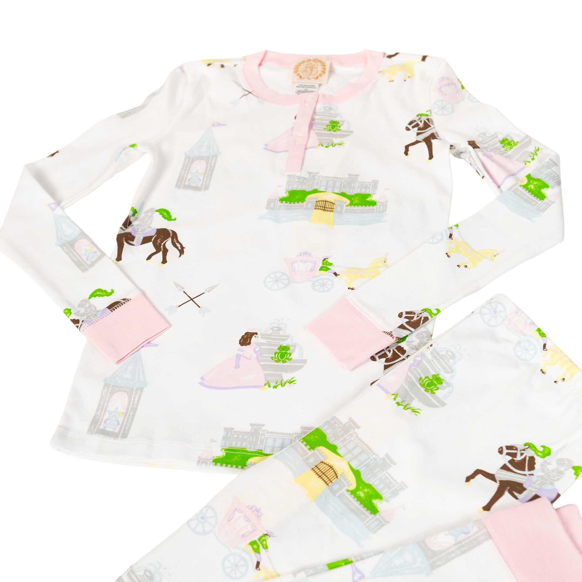 White children's pajamas with a pink trim, featuring a horse-themed pattern.