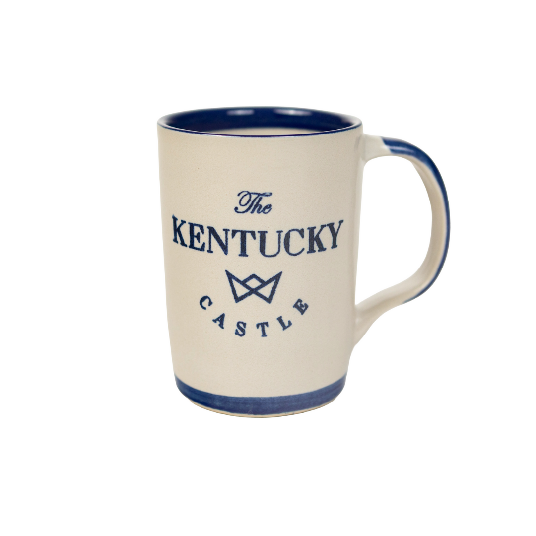 Cream-colored coffee mug with blue trim and text