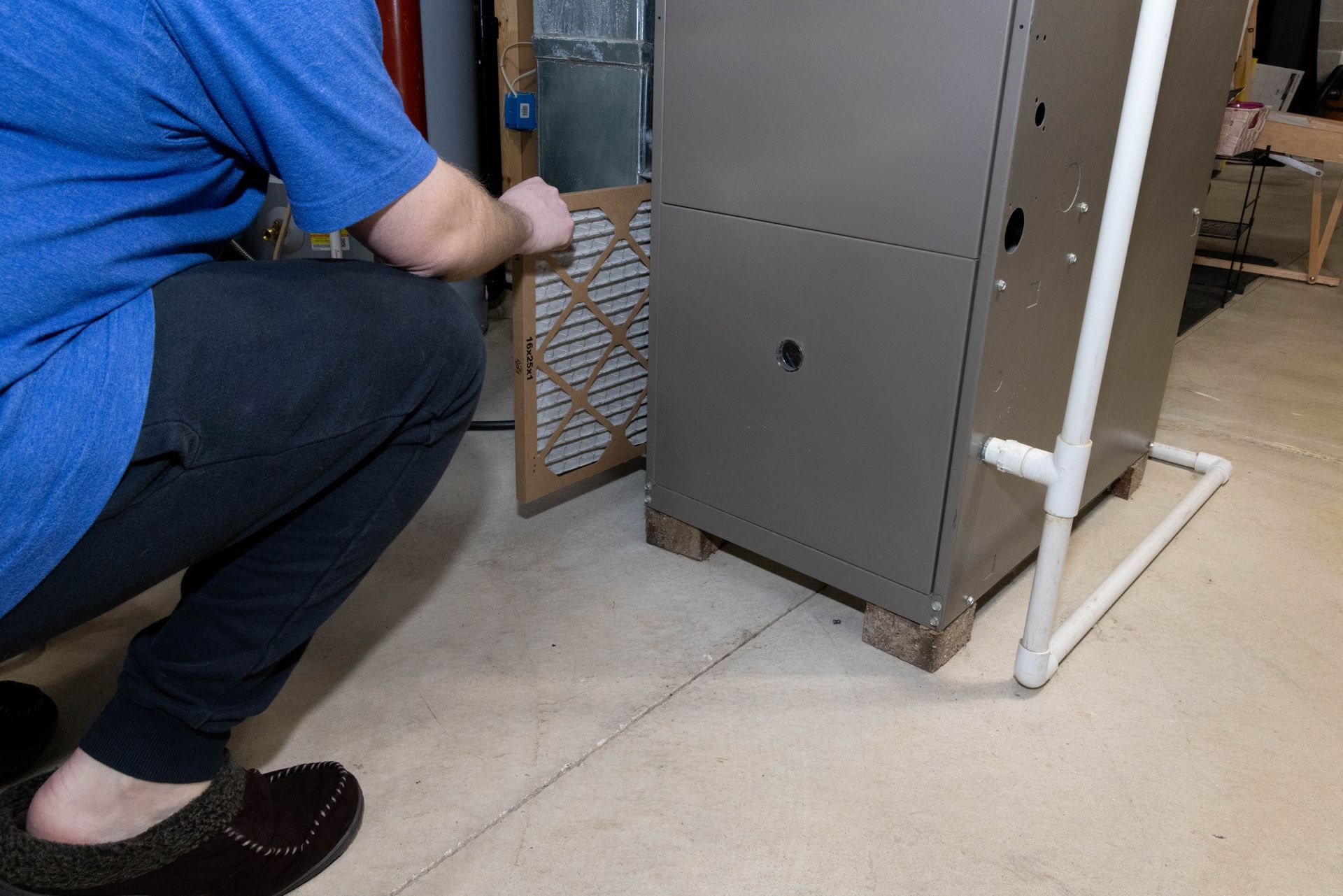 HVAC technician installing a new furnace in Mt. Clemens