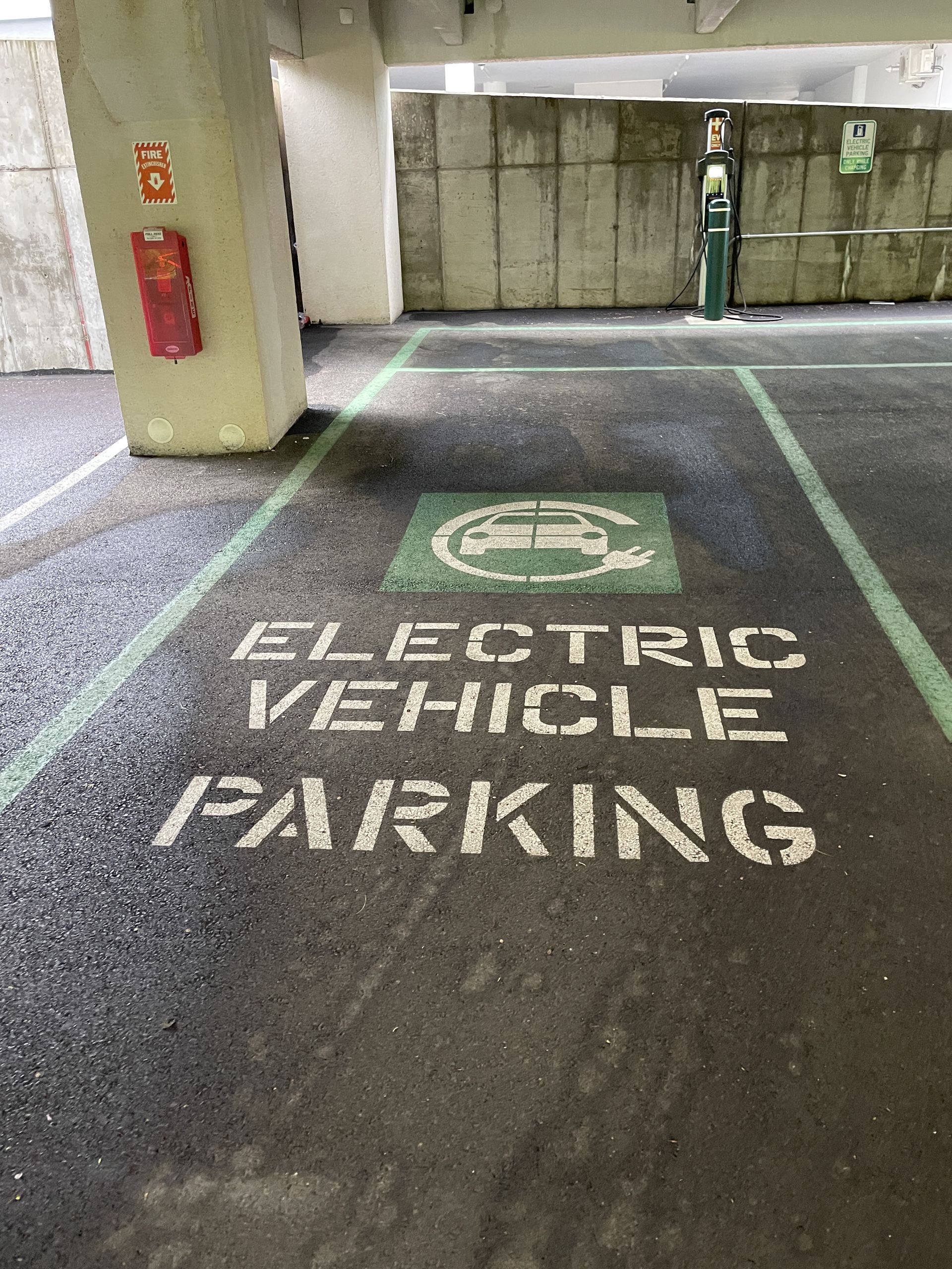 A painted parking spot on asphalt labeled 