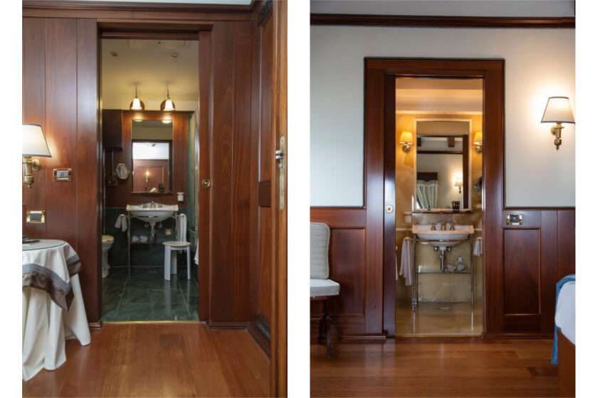 Two interior views of a hotel bathroom featuring rich wood paneling, elegant vanity mirrors, and marble flooring.