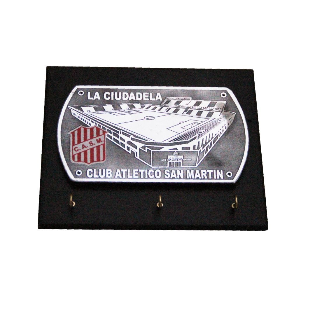 Black plaque with a silver emblem reading “La Ciudadela” and “Club Atlético San Martín”