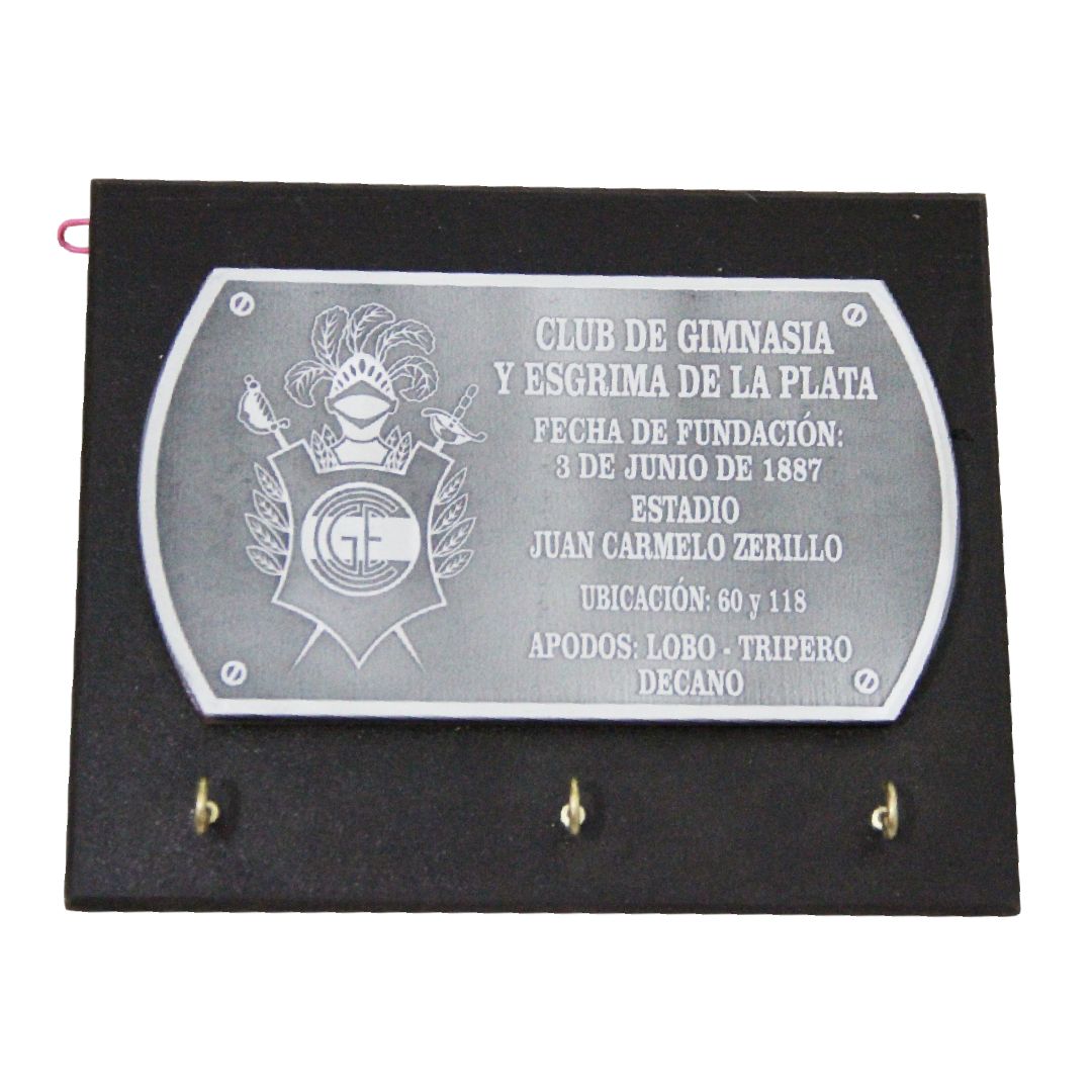 Plaque commemorating Club de Gimnasia y Esgrima La Plata, mounted on a black base.