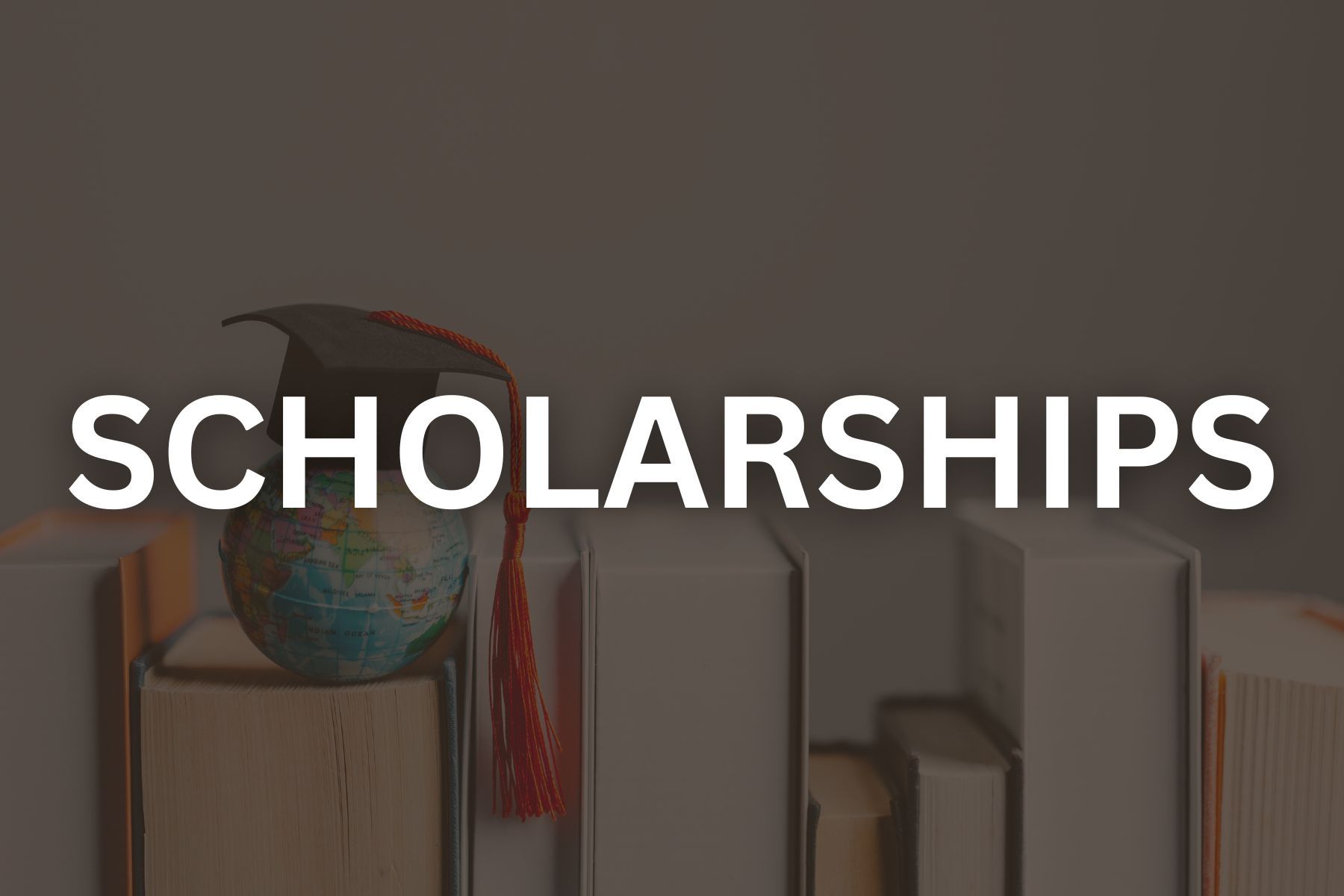 Photo of books with black overlay that reads scholarship