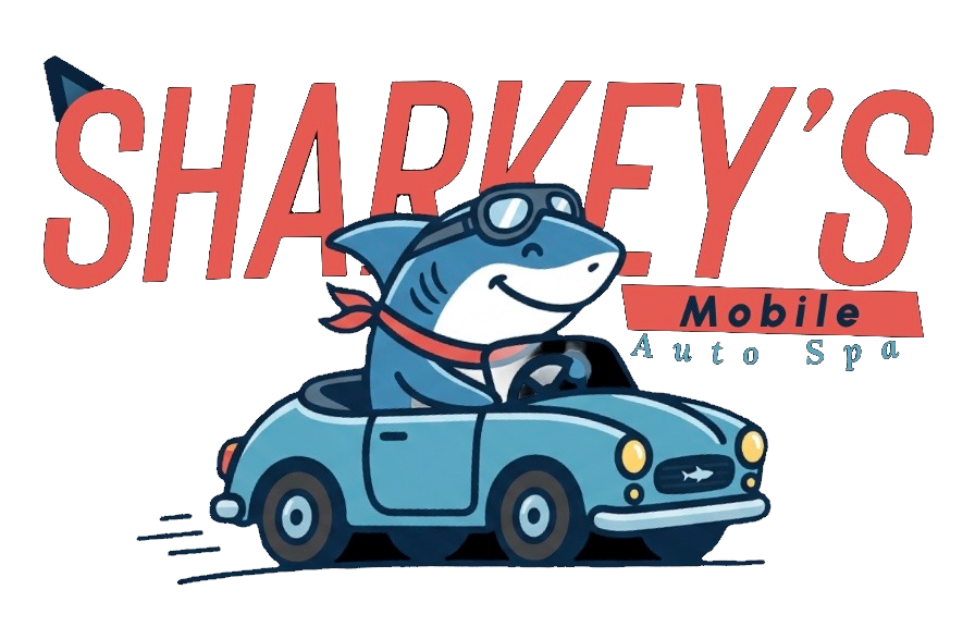 Sharkey’s Mobile Auto Spa logo with a smiling shark driving a blue car