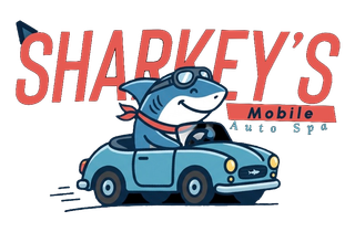 Sharkey’s Mobile Auto Spa logo with a smiling shark driving a blue car