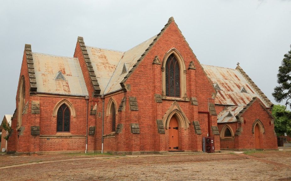 Red Brick Church with Pointed Arch Windows — Cartech Australia in Corowa, NSW