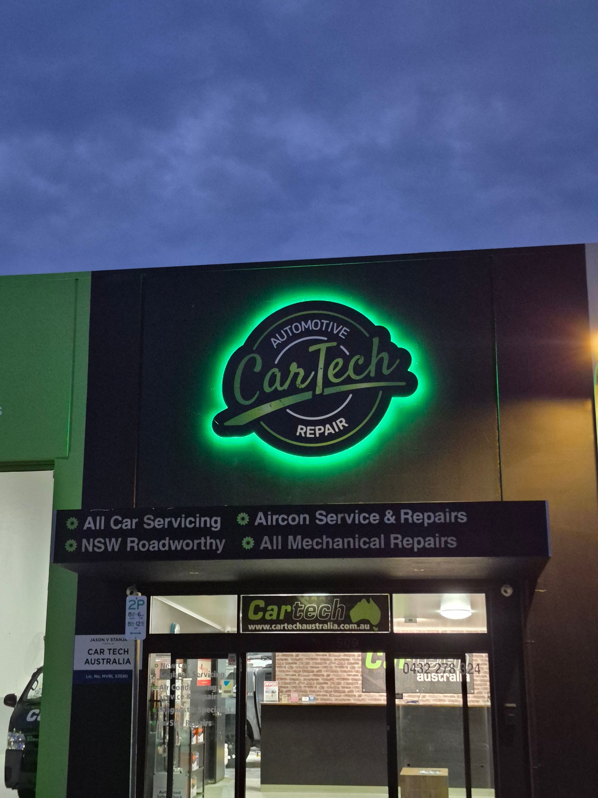 CarTech Repair shop exterior with illuminated green logo, black awning, and service descriptions  — Cartech Australia in Albury, NSW