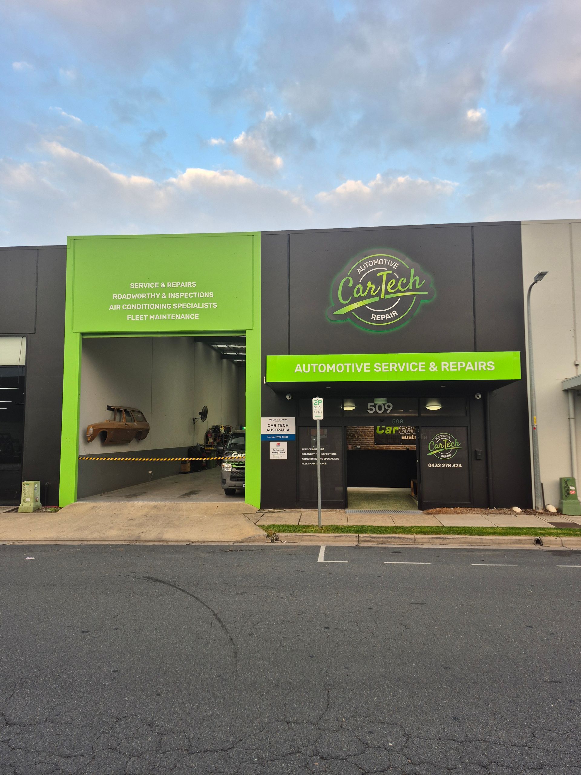 Exterior of Cartech automotive shop with green and black facade — Cartech Australia in Wodonga, NSW