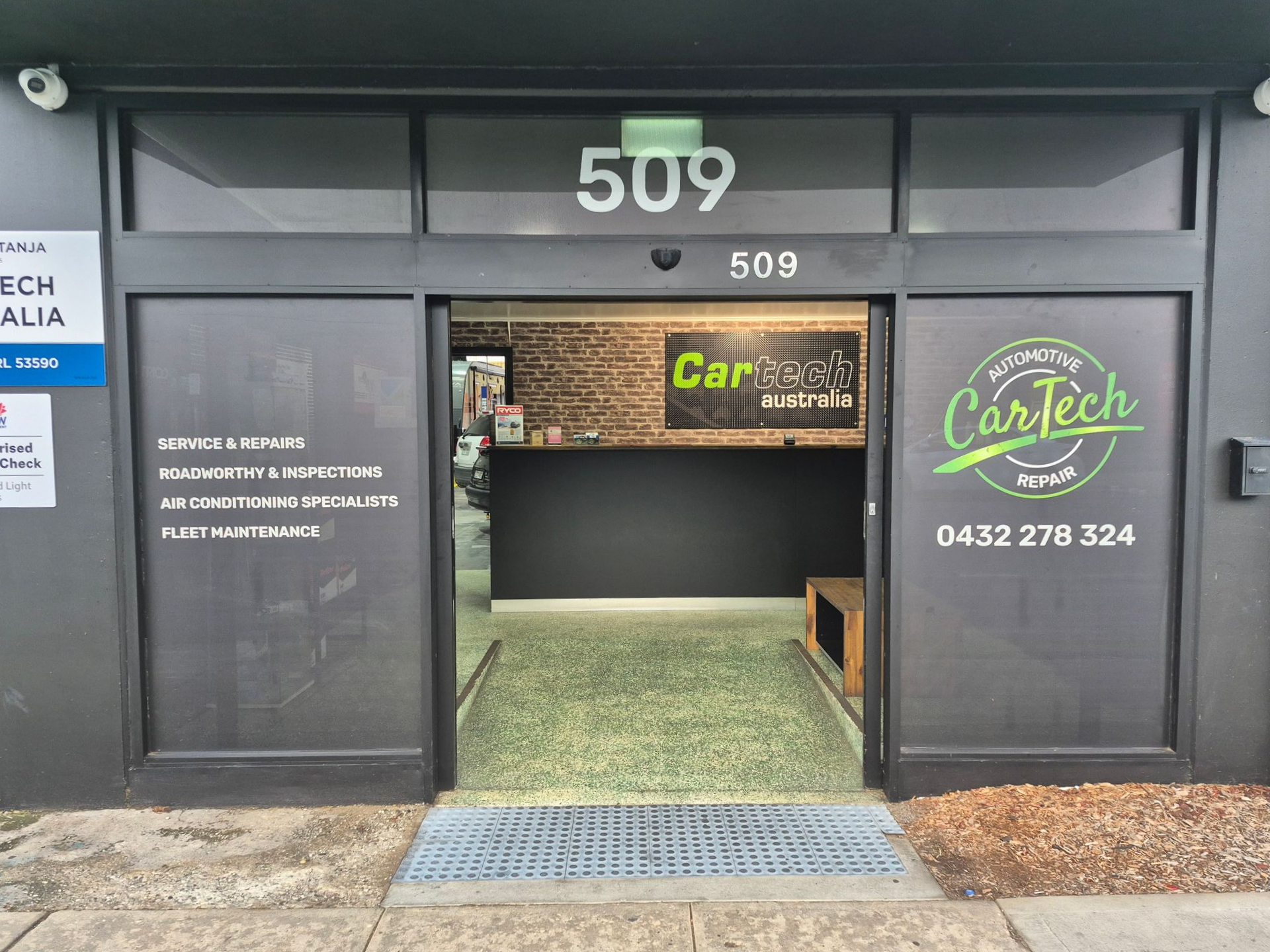 Exterior of CarTech auto repair shop at 509, with glass door and green logo  — Cartech Australia in Albury, NSW