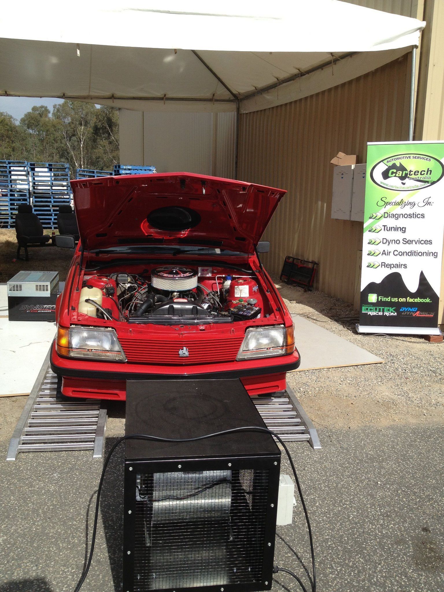 Red Car with Open Hood on A Dynamometer — Cartech Australia in Albury, NSW