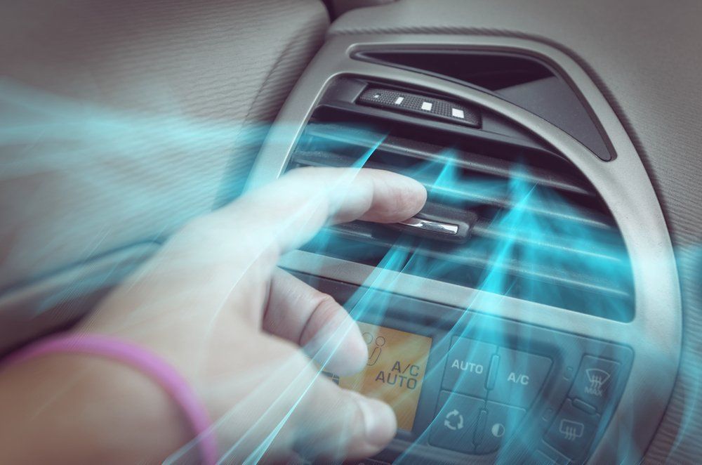 Hand Adjusting a Car's Air Conditioning Vent — Cartech Australia in Albury, NSW