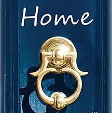 A blue door with a gold door knocker on it.
