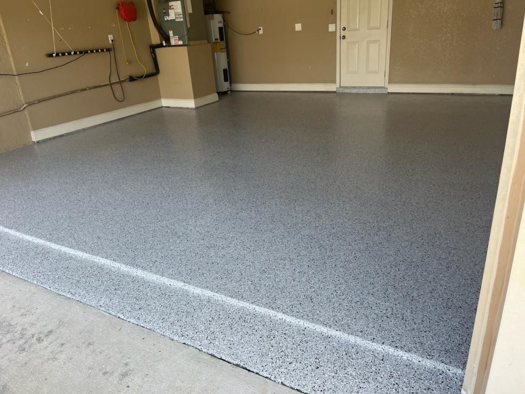 Garage with a gray epoxy floor.