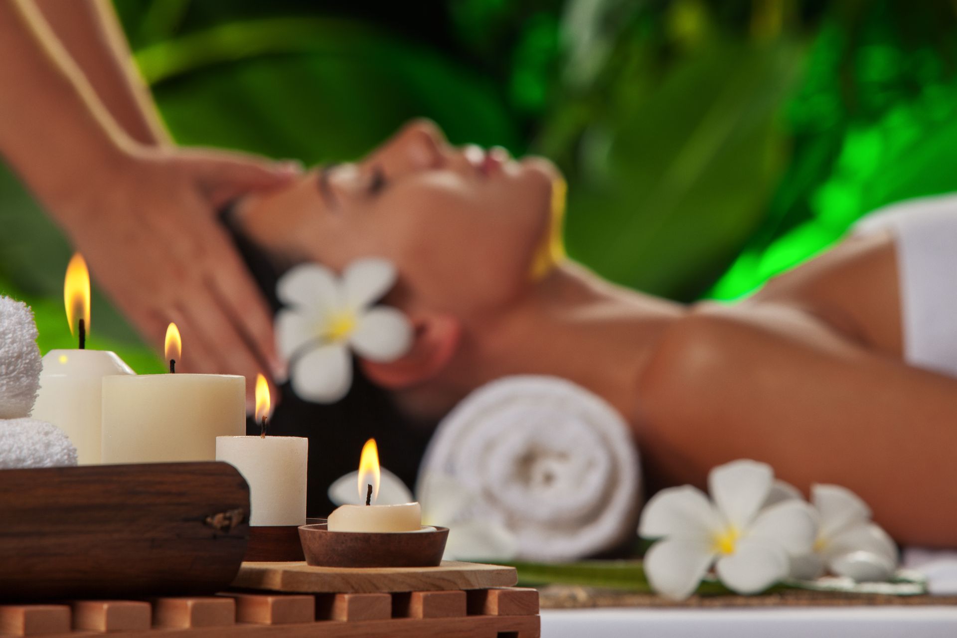Woman receiving a head massage at a spa - Thames, NZ - Thai Classic Massage Thames