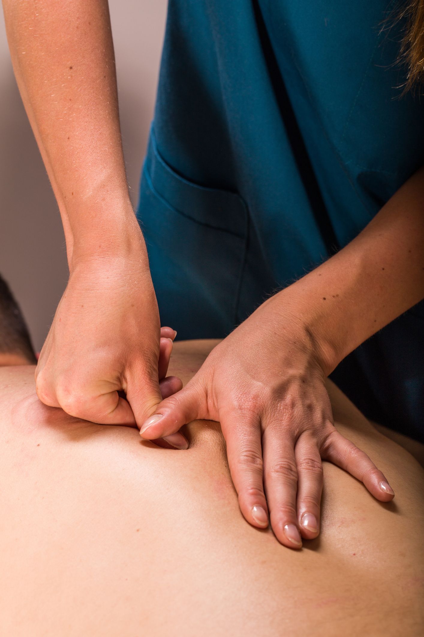 Hands performing massage on a person's back - Thames, NZ - Thai Classic Massage Thames