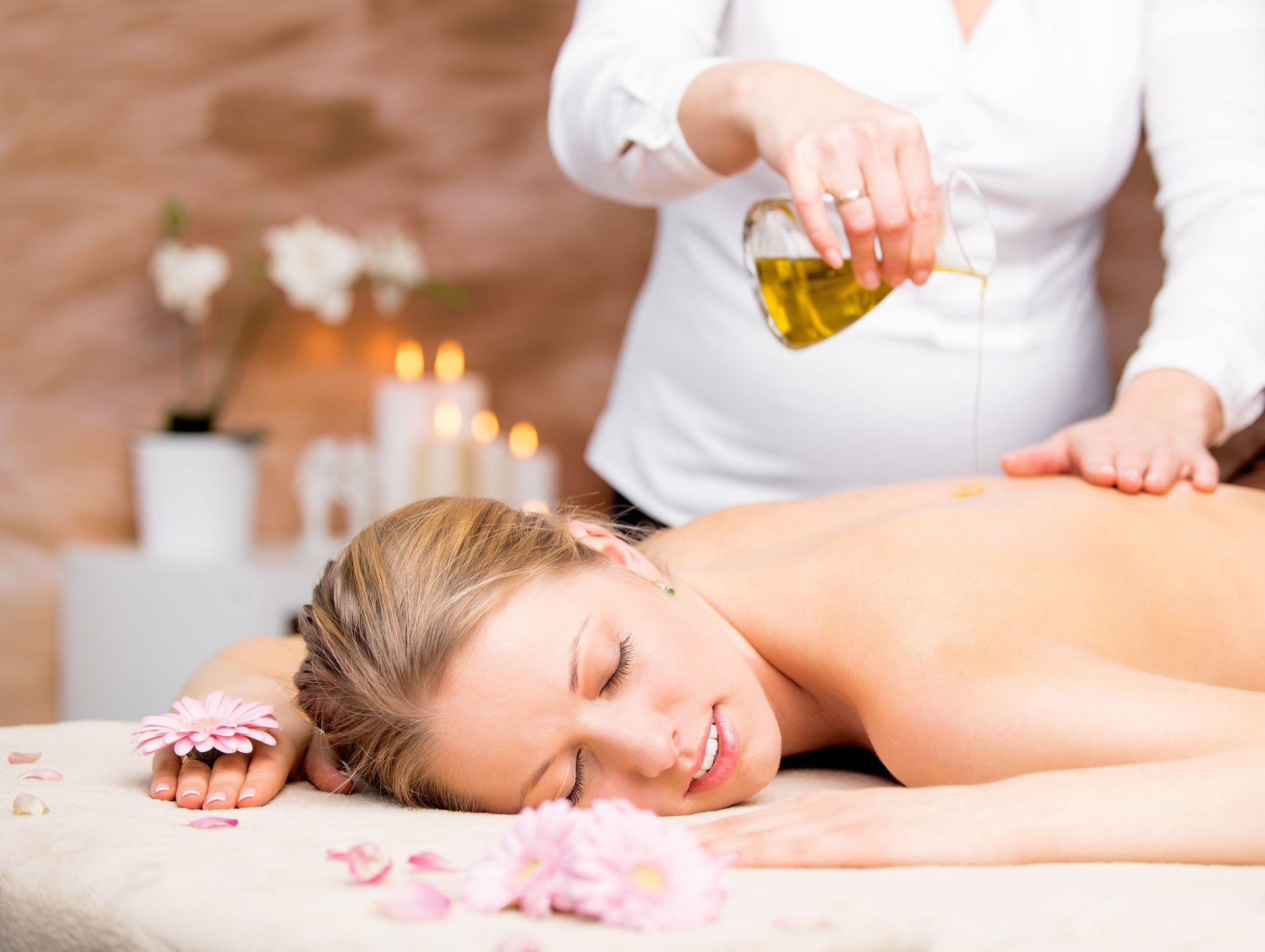 Woman receiving a back massage with oil in a spa setting - Thames, NZ - Thai Classic Massage Thames