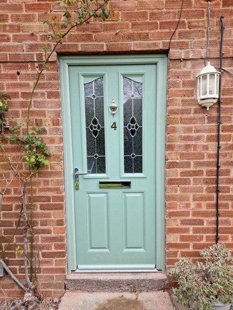 Bespoke cottage-style composite front door in Chartwell Green installed in Warwickshire.