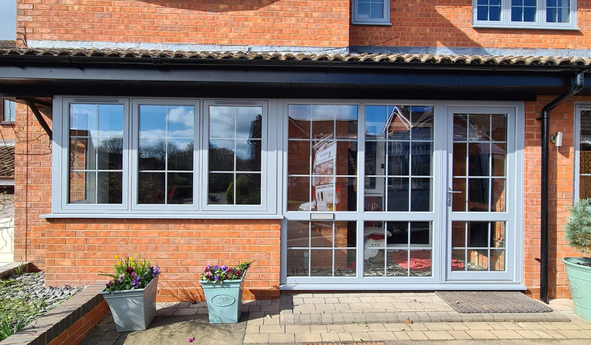 Open glazed front door and porch in elephant grey
