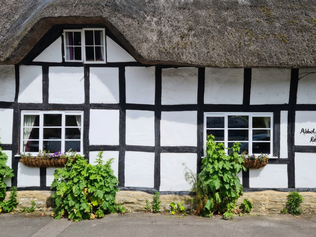 A traditional half-timbered cottage double glazed windows installed by Prior Products Stratford-upon-Avon