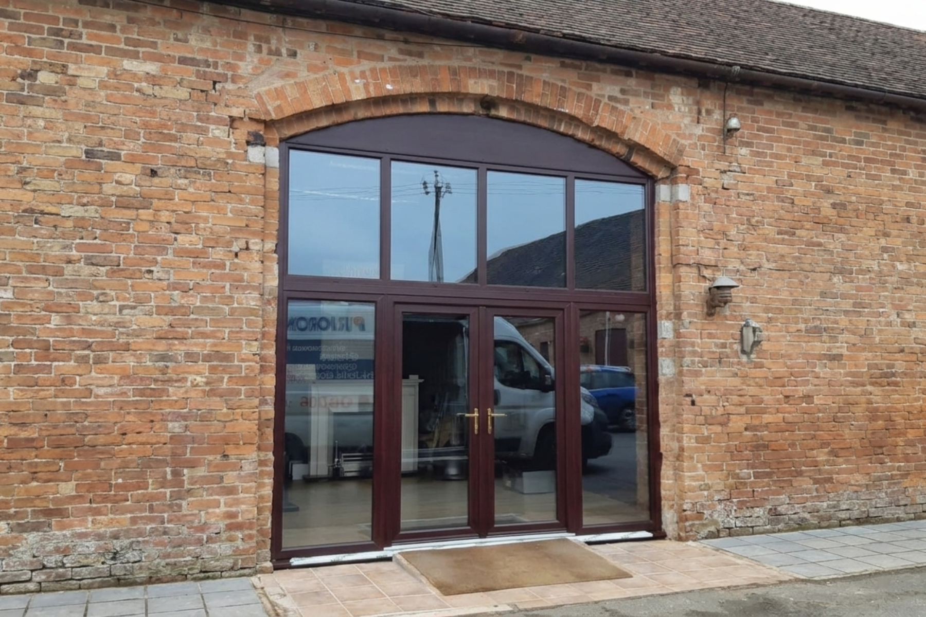 Beautiful French doors in Rosewood uPVC with arch top