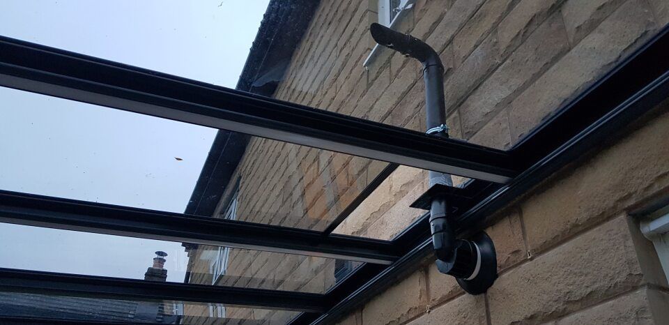 A canopy is attached to the side of a building.