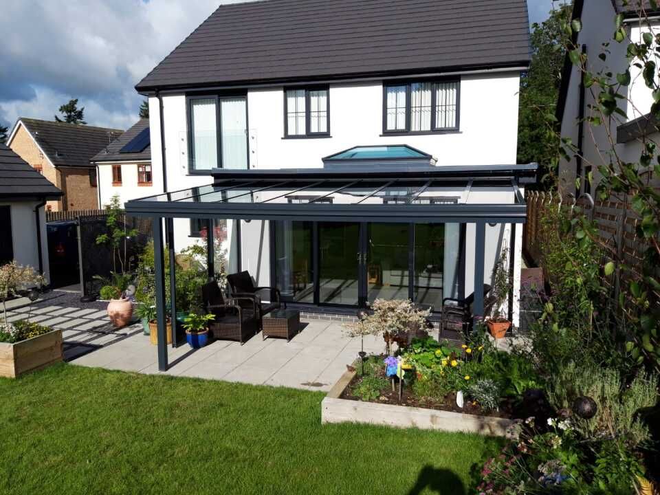 A large white house with a large patio in front of it