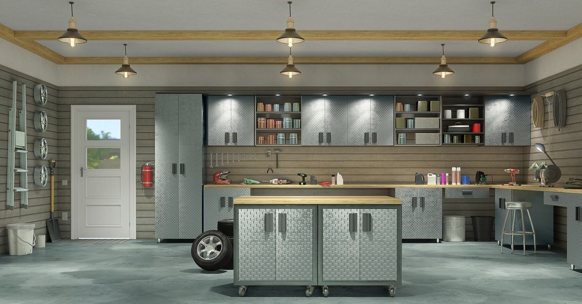 A finished garage interior features cabinets, a workbench, overhead lighting, and organized tools arranged along the walls.