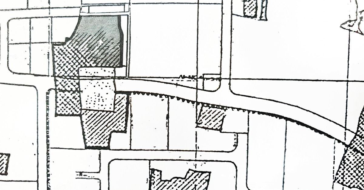 A black-and-white cadastral map with outlined land plots, zoning boundaries, and varied parcel shapes.