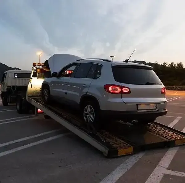 A Silver Suv is Being Towed by a Tow Truck — Johnson River Towing In Innisfail, QLD