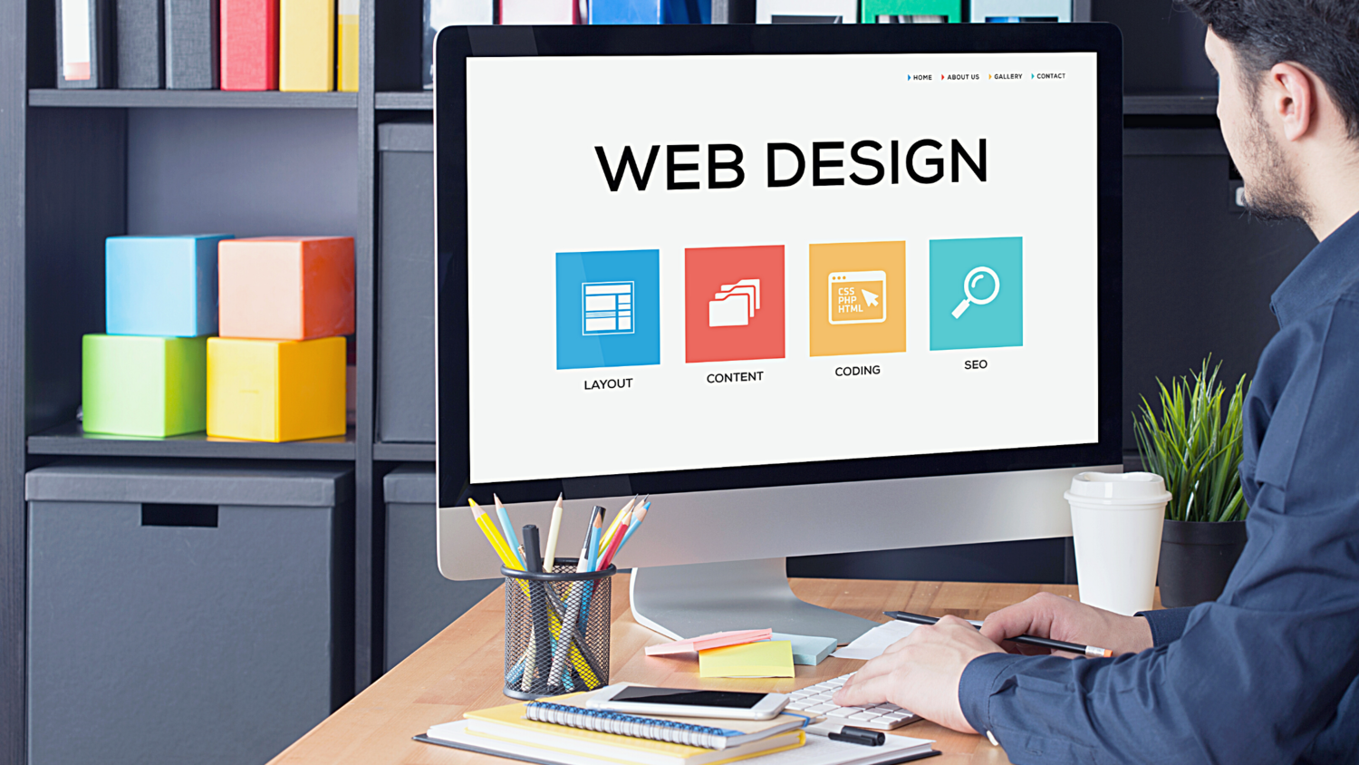 Man working at computer with Web Design