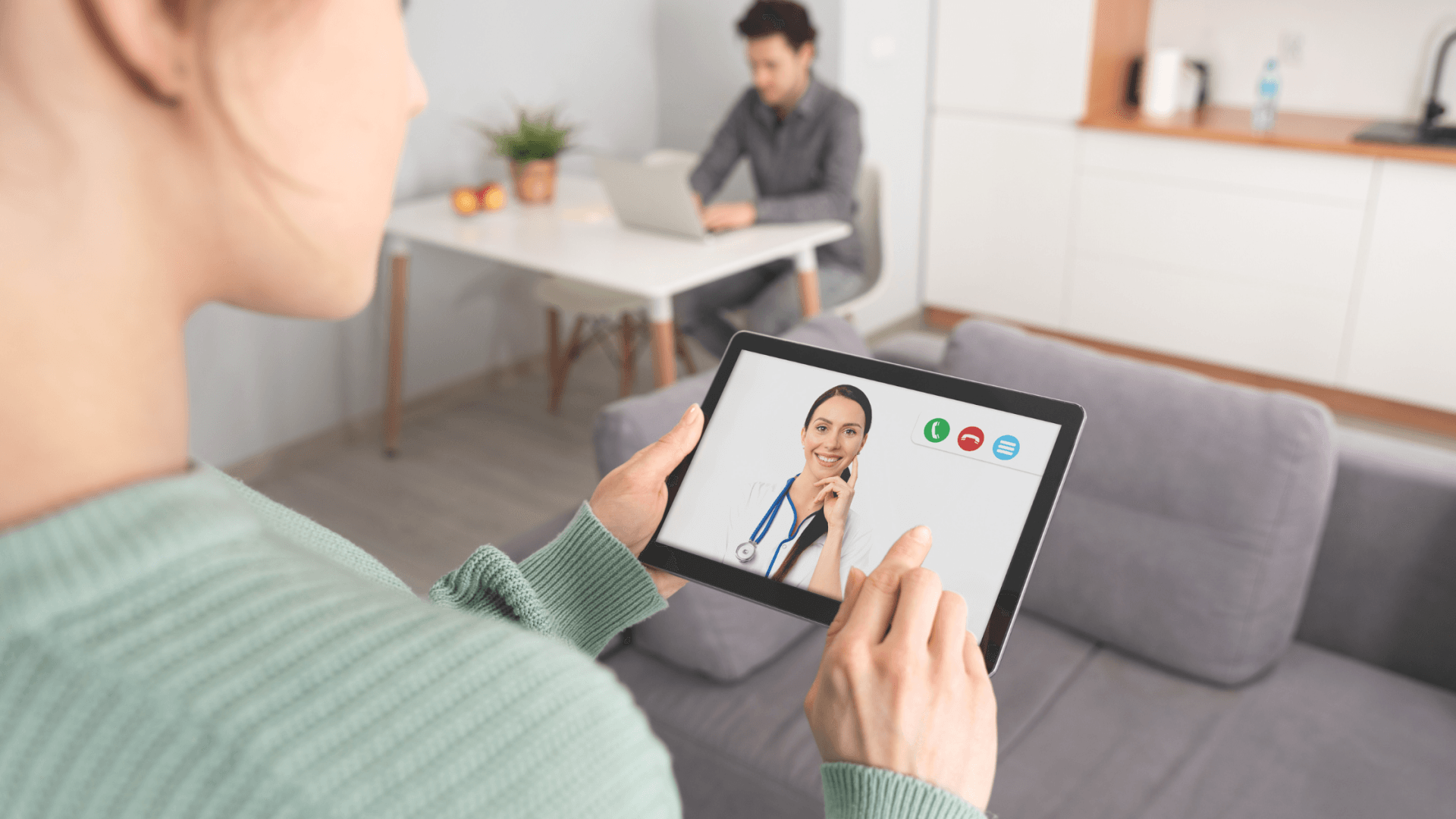 Patient on iPad for telehealth appointment