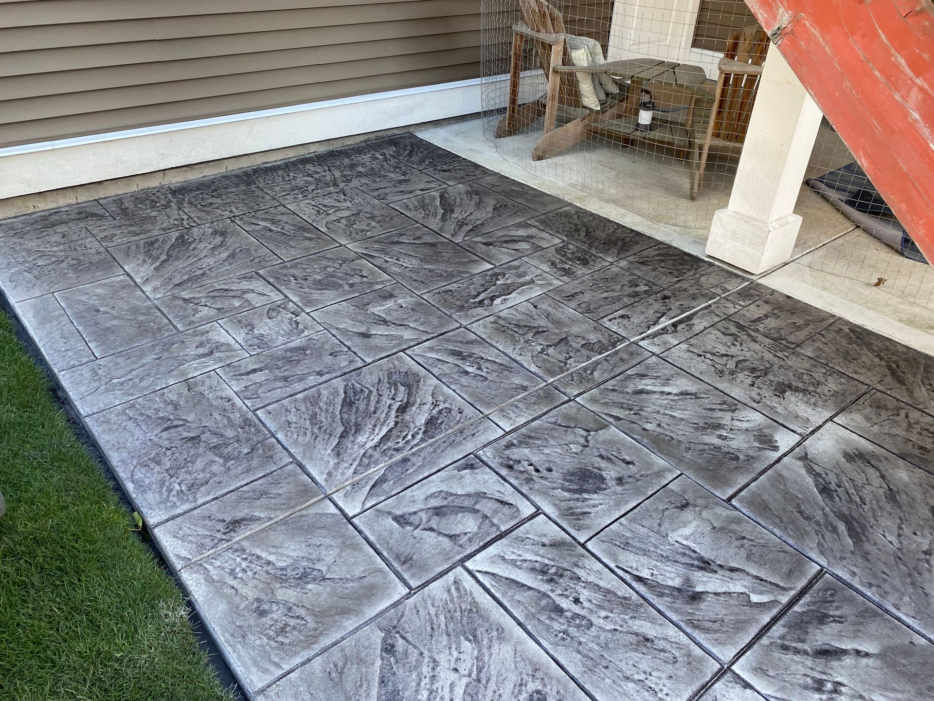 Stamped concrete walkway with a stone pattern