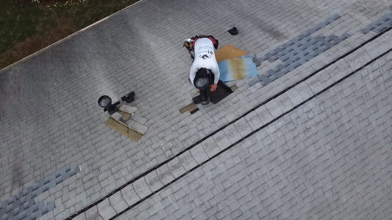 4H Roofing worker performing roof work near vents on a Georgia home.