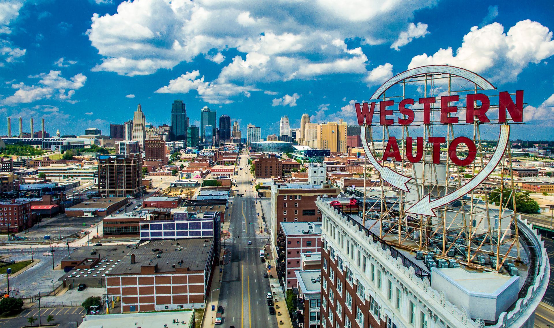 An aerial view of a city with a sign that says western auto