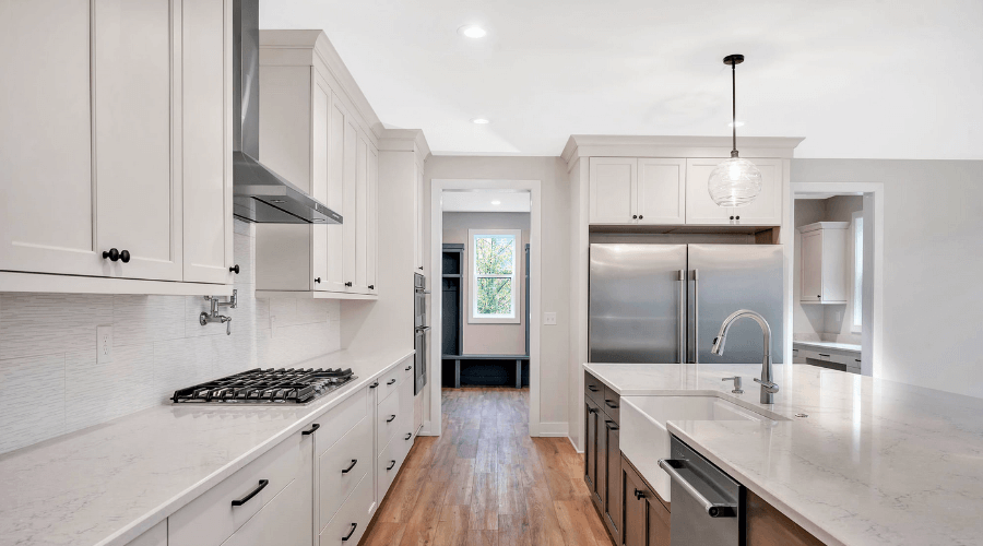 Kitchen with clean, white cabinets and hardwood floors