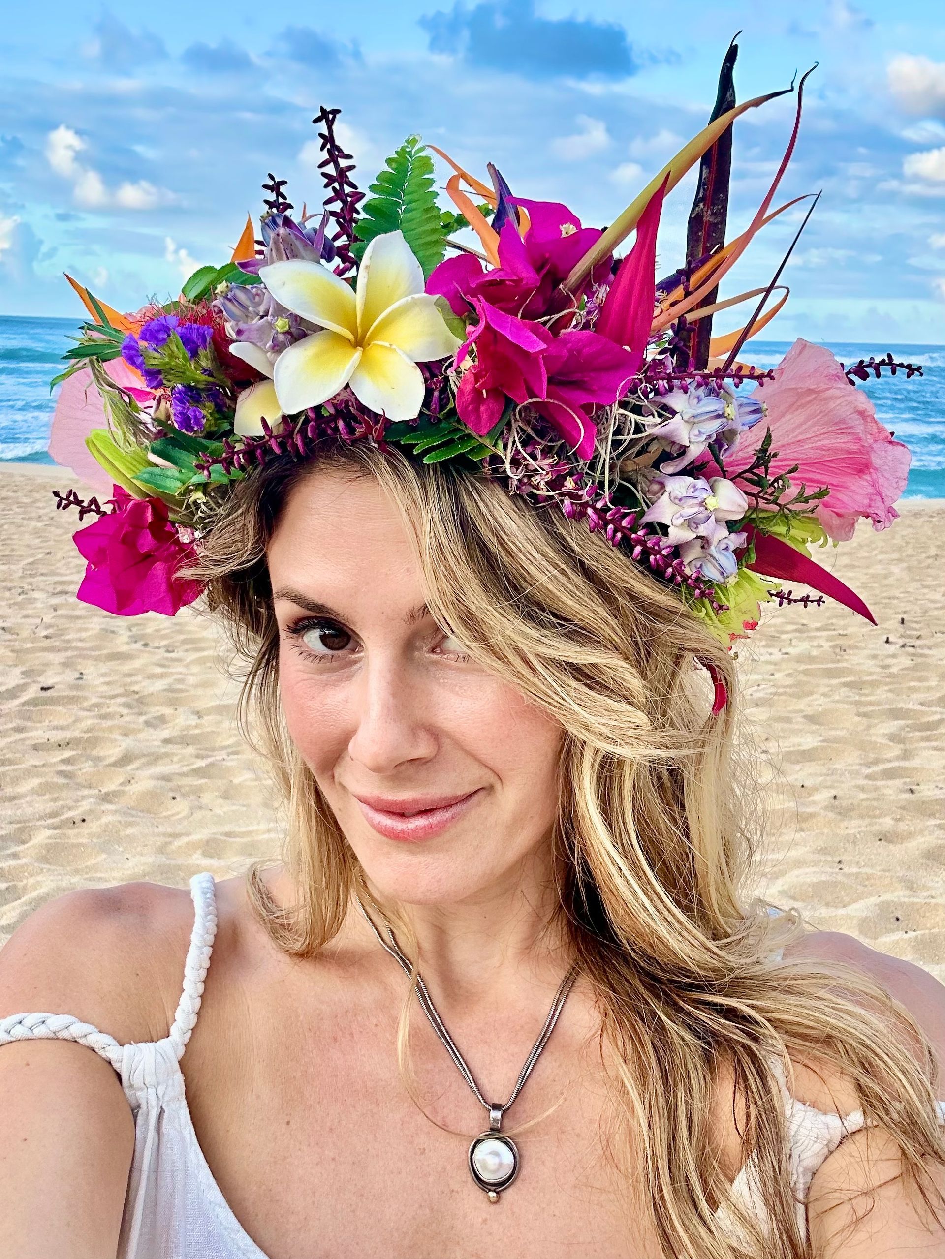 Dr. Bathurst smiling with traditional lei po'o
