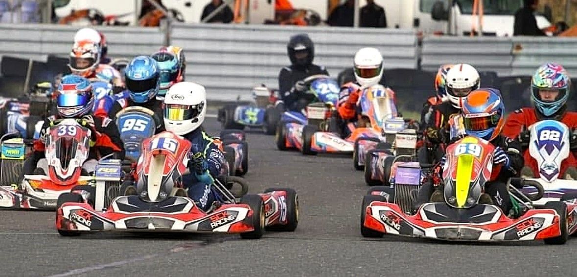photo of sck racing karts going round clay pigeon raceway in 1st and 2nd