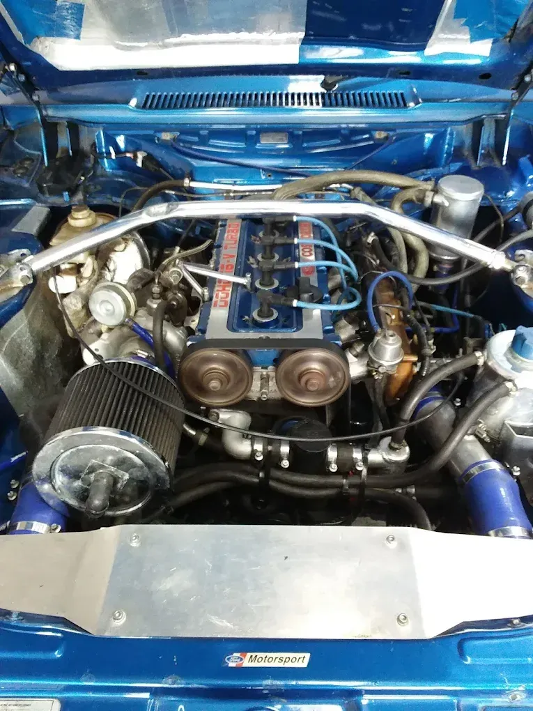 Classic Ford engine with twin carburetors and performance upgrades. — Chris Bale Automotive in Toronto, NSW