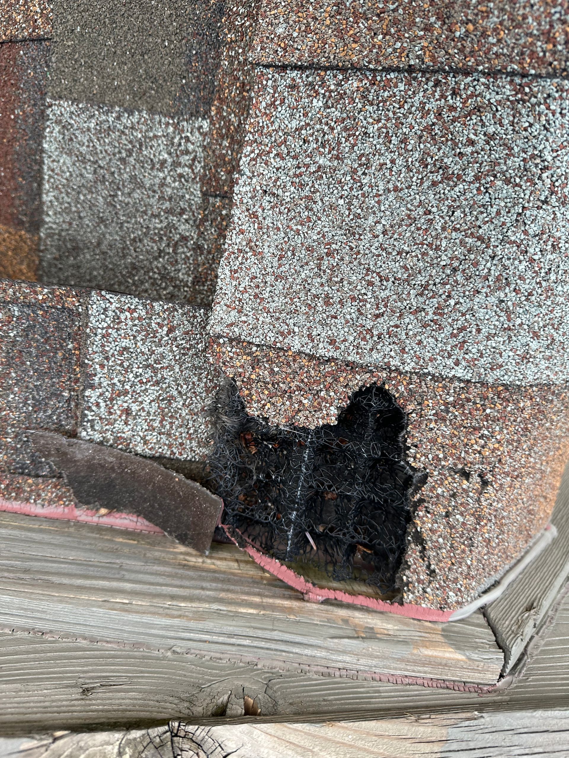 A close up of a roof with a hole in it.