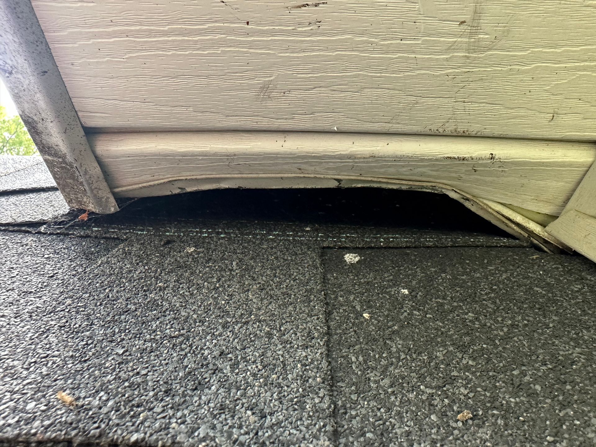 A close up of a roof with a hole in it.