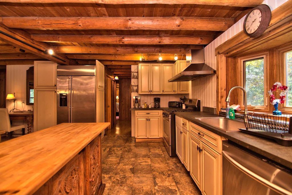 A kitchen with stainless steel appliances and wooden cabinets