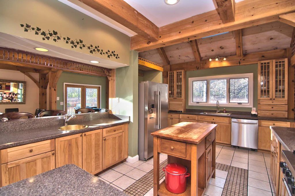A kitchen with stainless steel appliances and wooden cabinets