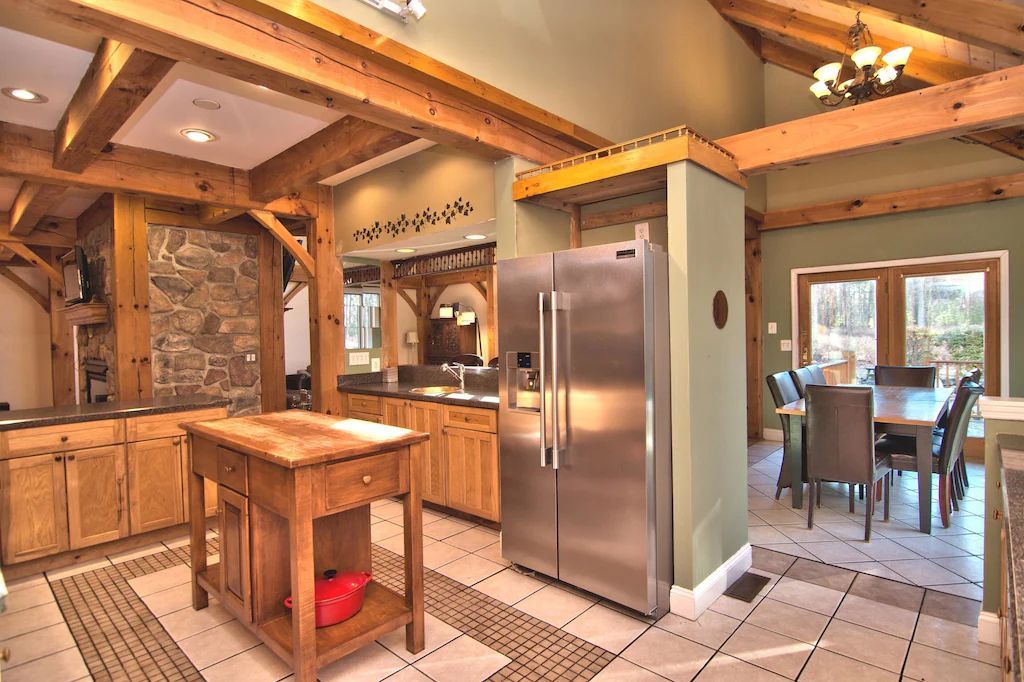 A kitchen with stainless steel appliances and wooden cabinets