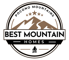 The logo for best mountain homes shows a mountain and a campfire.