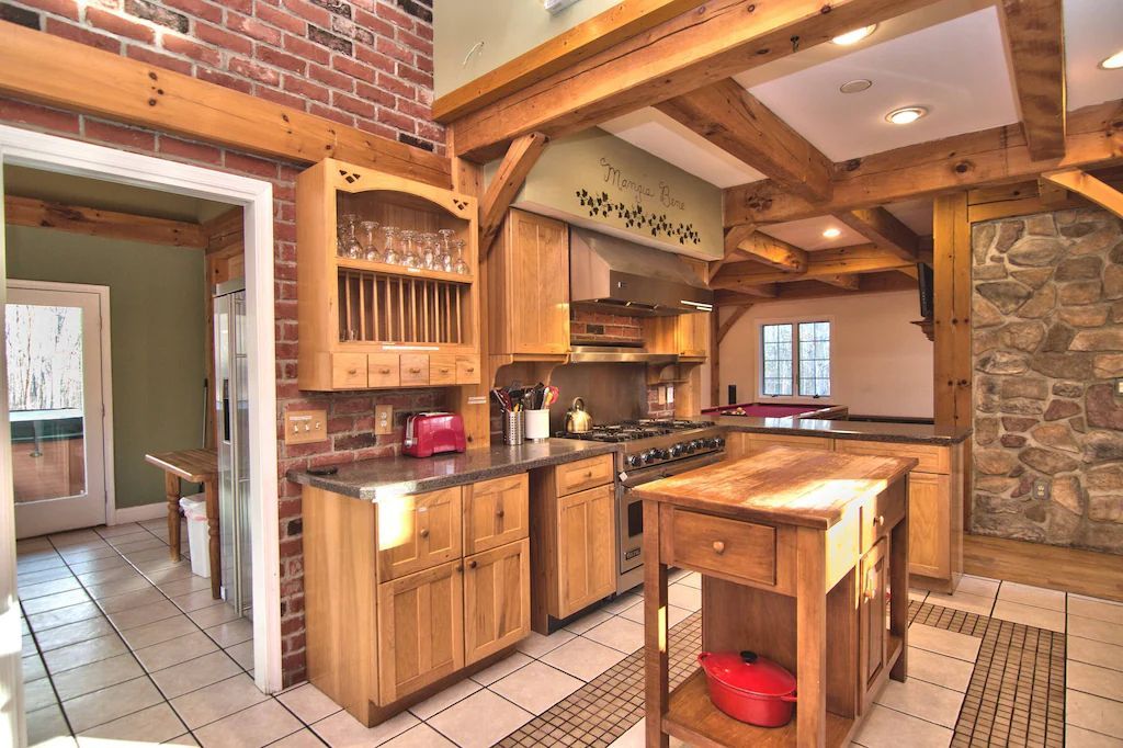 A kitchen with wooden cabinets and stainless steel appliances