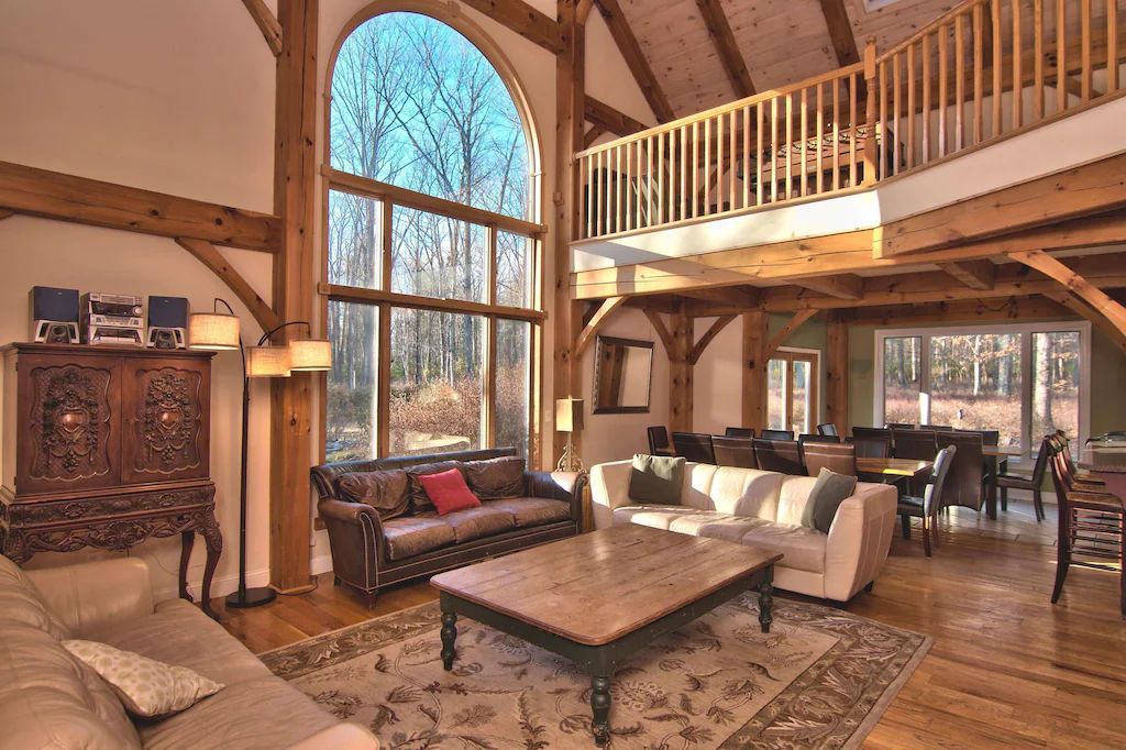 A living room filled with furniture and a large window.