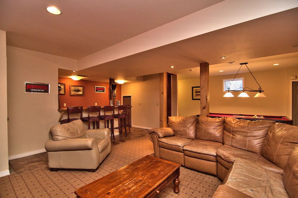A living room with a couch a chair and a coffee table